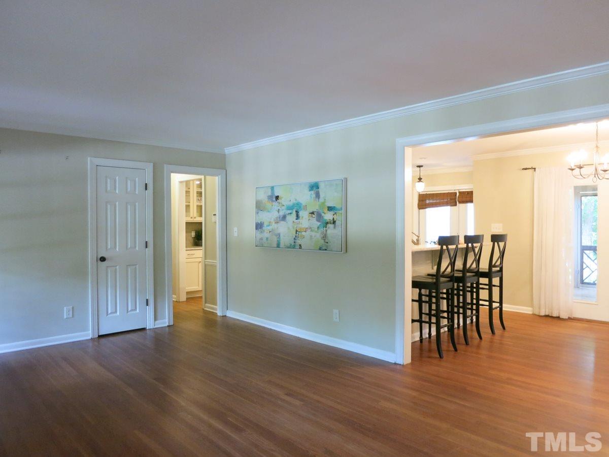 704 Currituck Drive Raleigh, NC 27609 - Photo 4 of 25 a view of a livingroom with furniture window and wooden floor