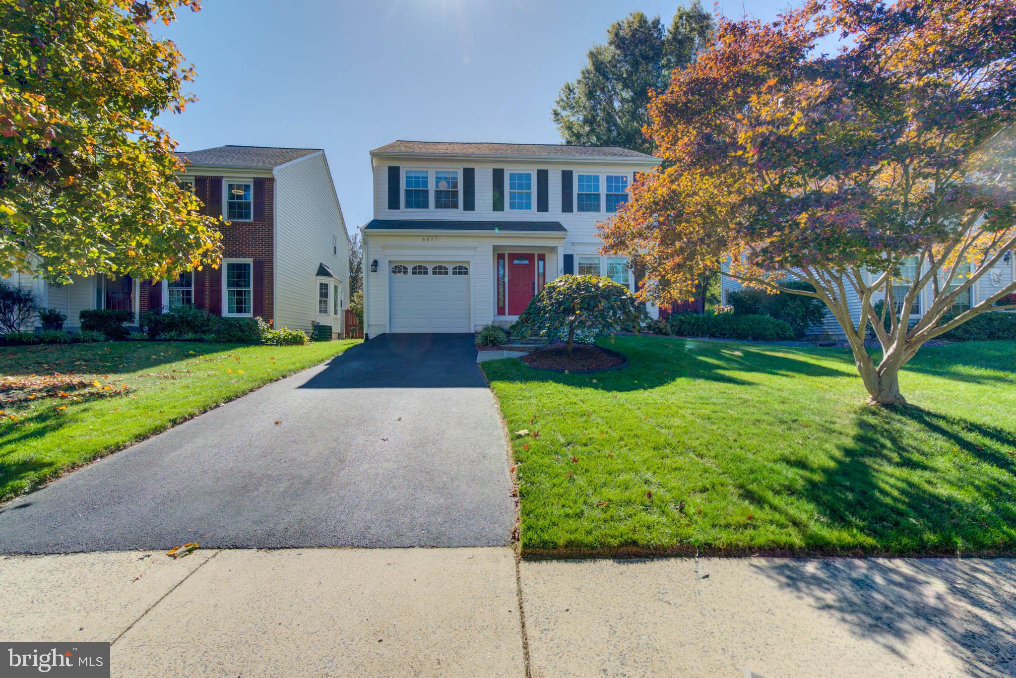 6617 Morning Ride Circle Alexandria, VA 22315 - Photo 1 of 51 a front view of a house with garden