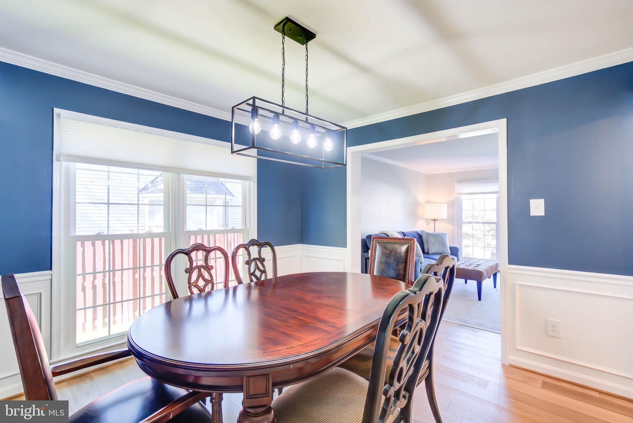 6617 Morning Ride Circle Alexandria, VA 22315 - Photo 13 of 51 a view of a dining room with furniture window and wooden floor