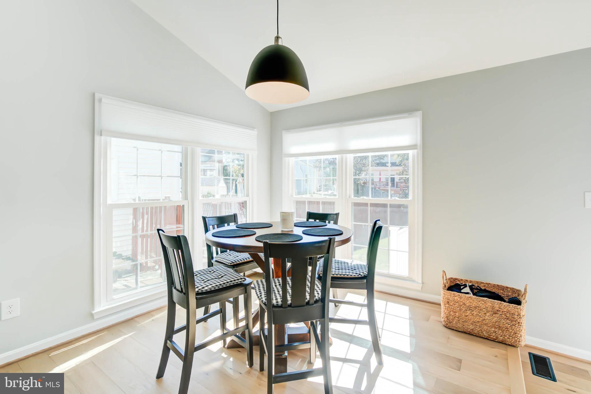 6617 Morning Ride Circle Alexandria, VA 22315 - Photo 20 of 51 a view of a dining room with furniture window and outside view
