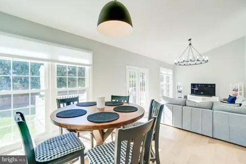 a view of a dining room with furniture and window
