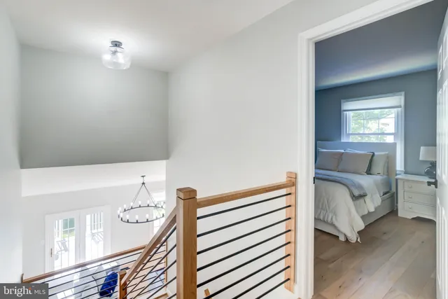 a view of bedroom with furniture and wooden floor
