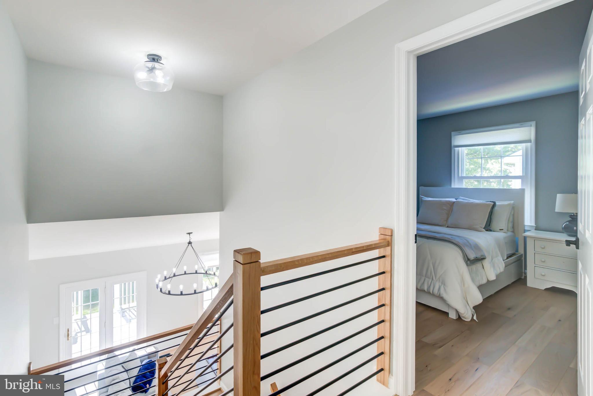 6617 Morning Ride Circle Alexandria, VA 22315 - Photo 28 of 51 a view of bedroom with furniture and wooden floor