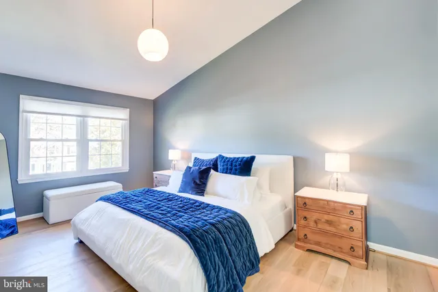 a bedroom with bed and window