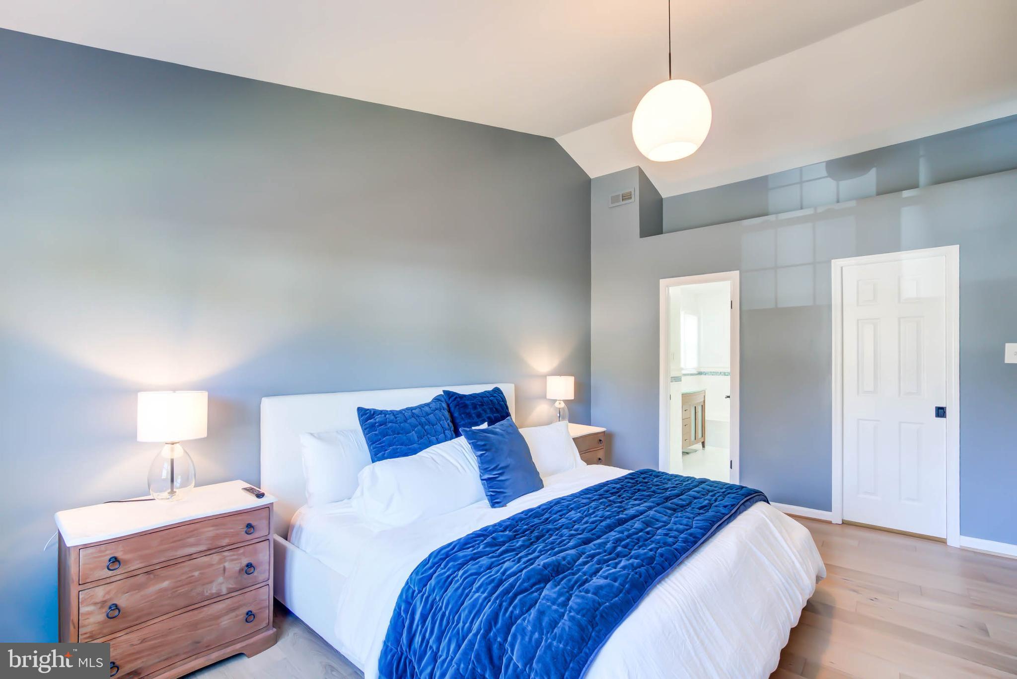 6617 Morning Ride Circle Alexandria, VA 22315 - Photo 32 of 51 a bedroom with a bed and wooden floor