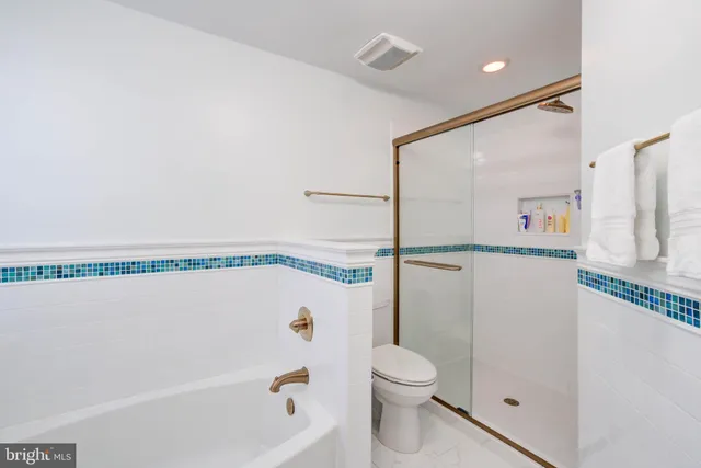 a bathroom with a shower and a bathtub