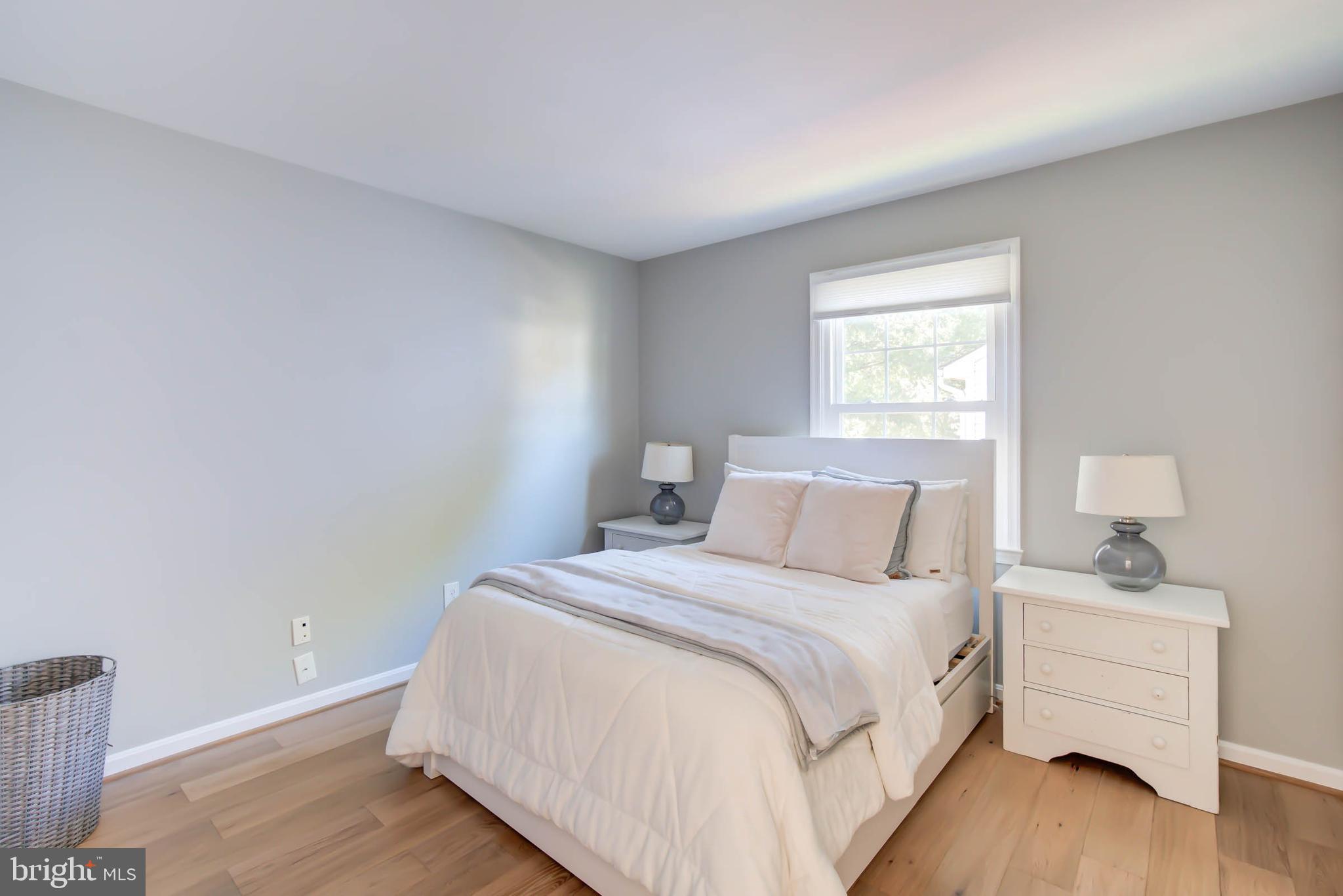 6617 Morning Ride Circle Alexandria, VA 22315 - Photo 37 of 51 a bedroom with a bed and a window