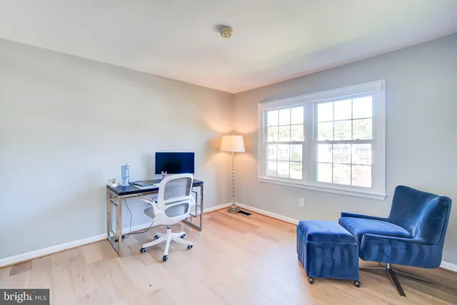 a view of room with wooden floor and chair