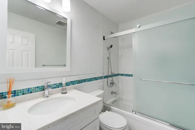 a view of a room with table and chairs