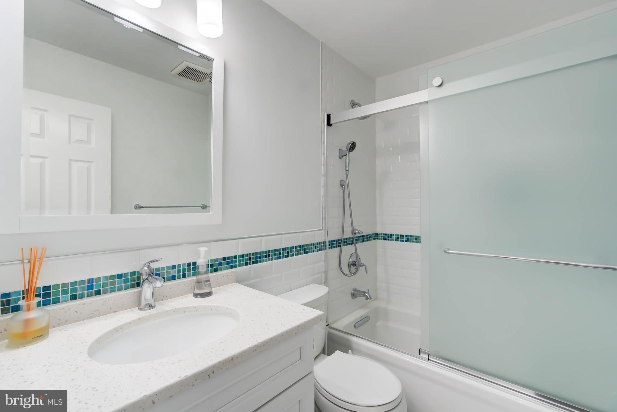 6617 Morning Ride Circle Alexandria, VA 22315 - Photo 42 of 51 a bathroom with a sink toilet and shower