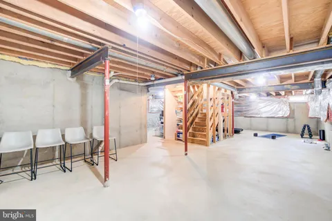 a bed room with a bed and a chair