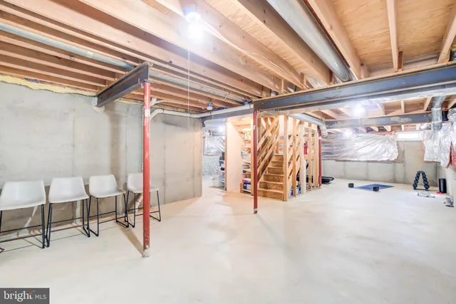 a bed room with a bed and a chair