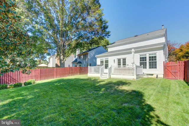 a view of a house with backyard and porch