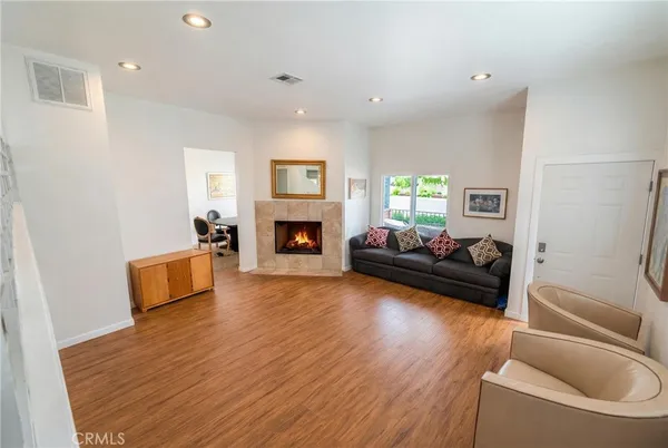 a living room with furniture and a fireplace
