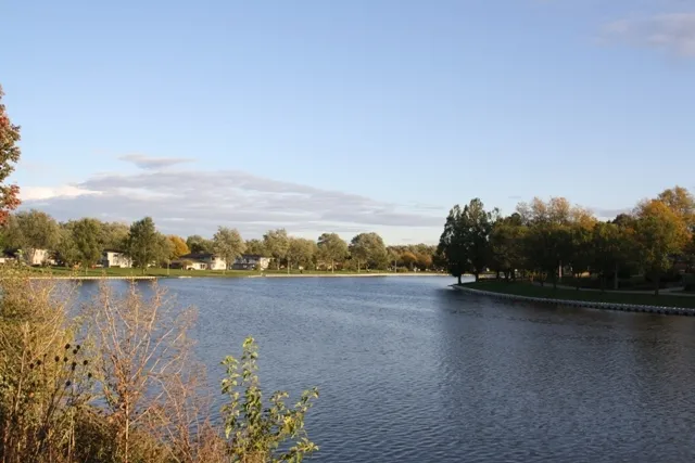 a view of lake with green space