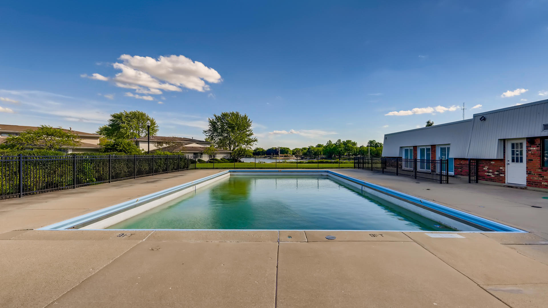 931 Shattuck Lane, Unit 931 Schaumburg, IL 60193 - Photo 15 of 15 a view of a swimming pool and a yard