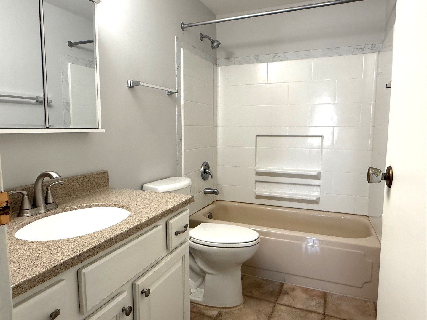 931 Shattuck Lane, Unit 931 Schaumburg, IL 60193 - Photo 9 of 15 a bathroom with a granite countertop sink toilet and shower