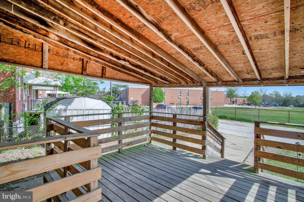 8352 Kavanagh Road Dundalk, MD 21222 - Photo 30 of 32 a view of a deck with wooden floor and outdoor seating