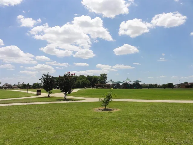 a view of a golf course with a lake