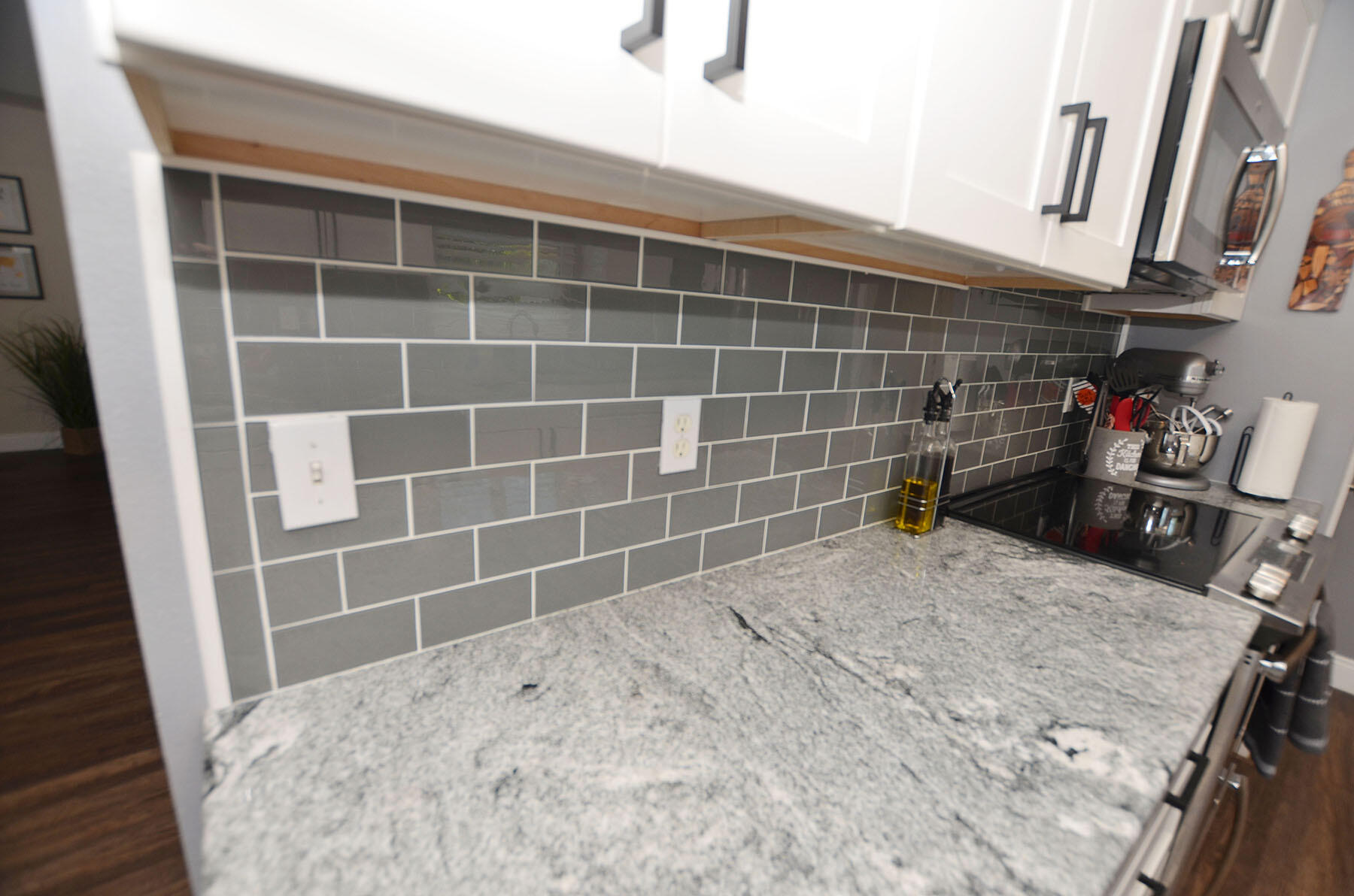 8271 Tavira Street Navarre, FL 32566 - Photo 19 of 60 a bathroom with a granite countertop sink a toilet and a shower