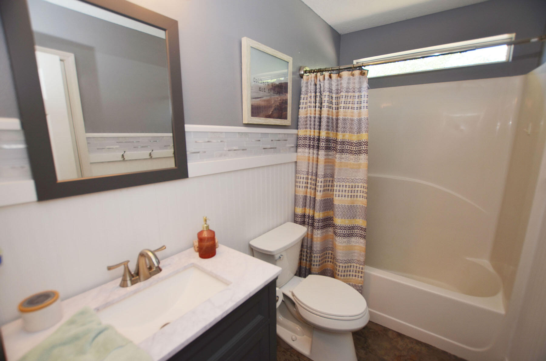 8271 Tavira Street Navarre, FL 32566 - Photo 38 of 60 a bathroom with a sink toilet and shower