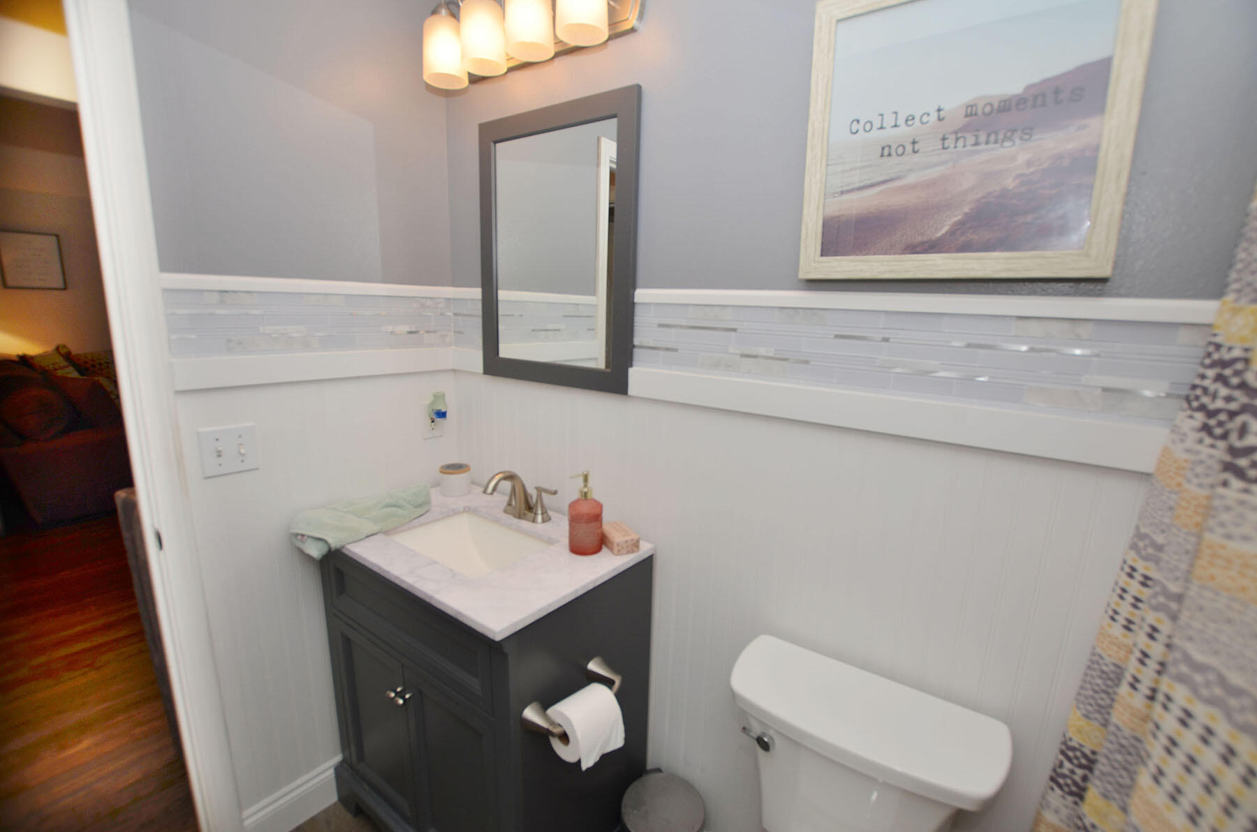 8271 Tavira Street Navarre, FL 32566 - Photo 39 of 60 a bathroom with a sink mirror and toilet