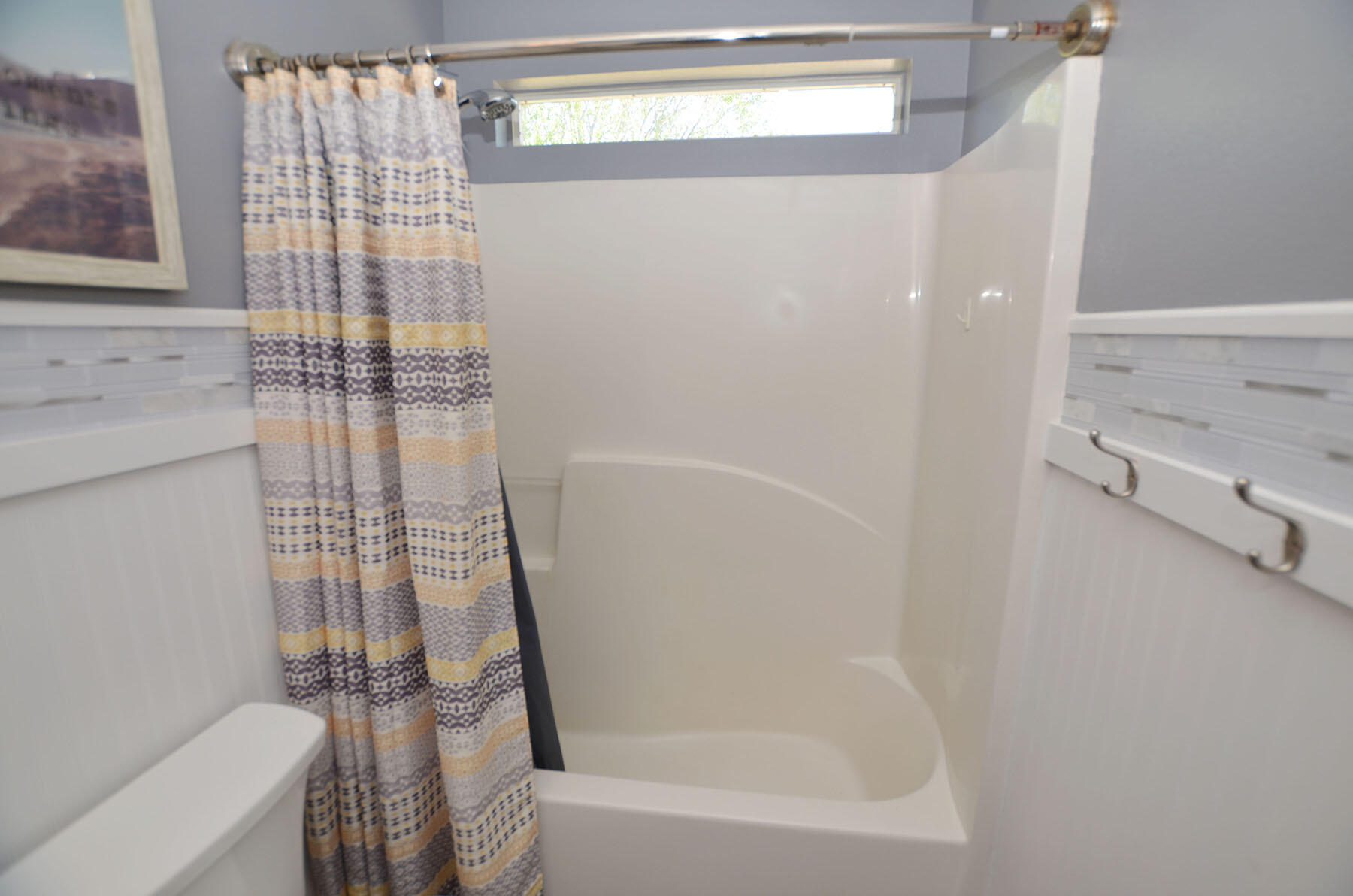 8271 Tavira Street Navarre, FL 32566 - Photo 40 of 60 a bathroom with a bathtub and shower
