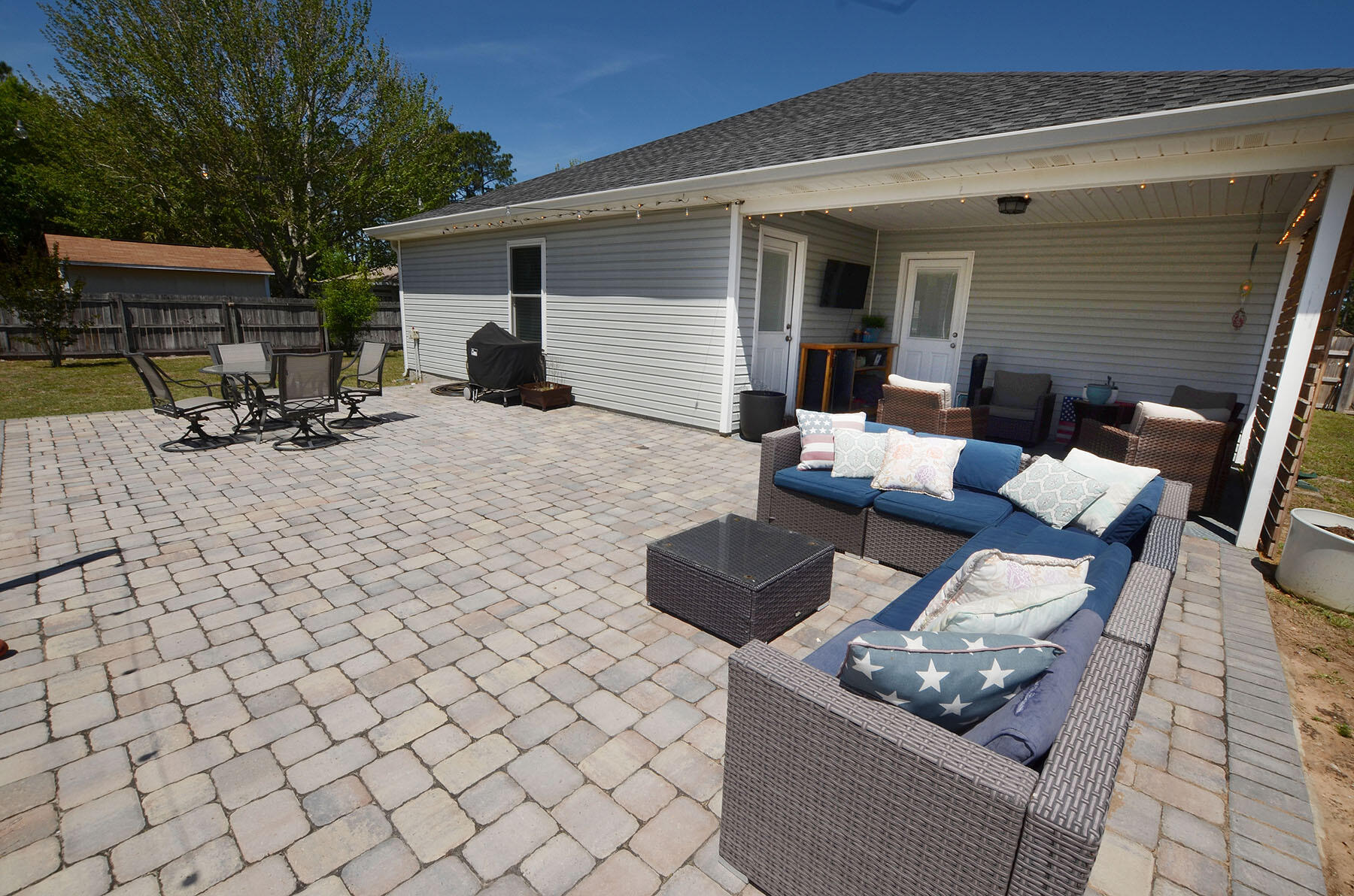 8271 Tavira Street Navarre, FL 32566 - Photo 50 of 60 a view of backyard of the house with seating space