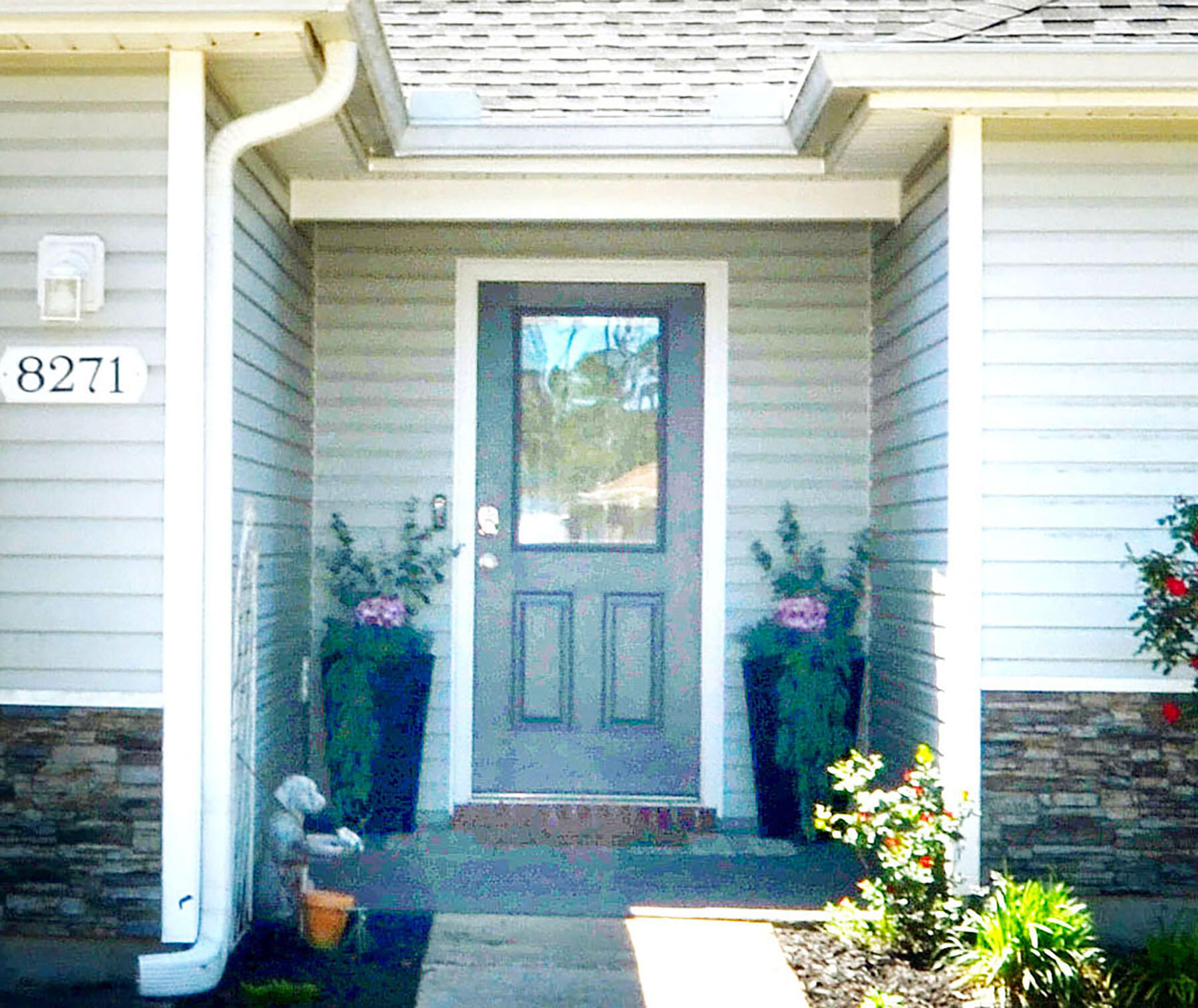 8271 Tavira Street Navarre, FL 32566 - Photo 5 of 60 a front view of a house
