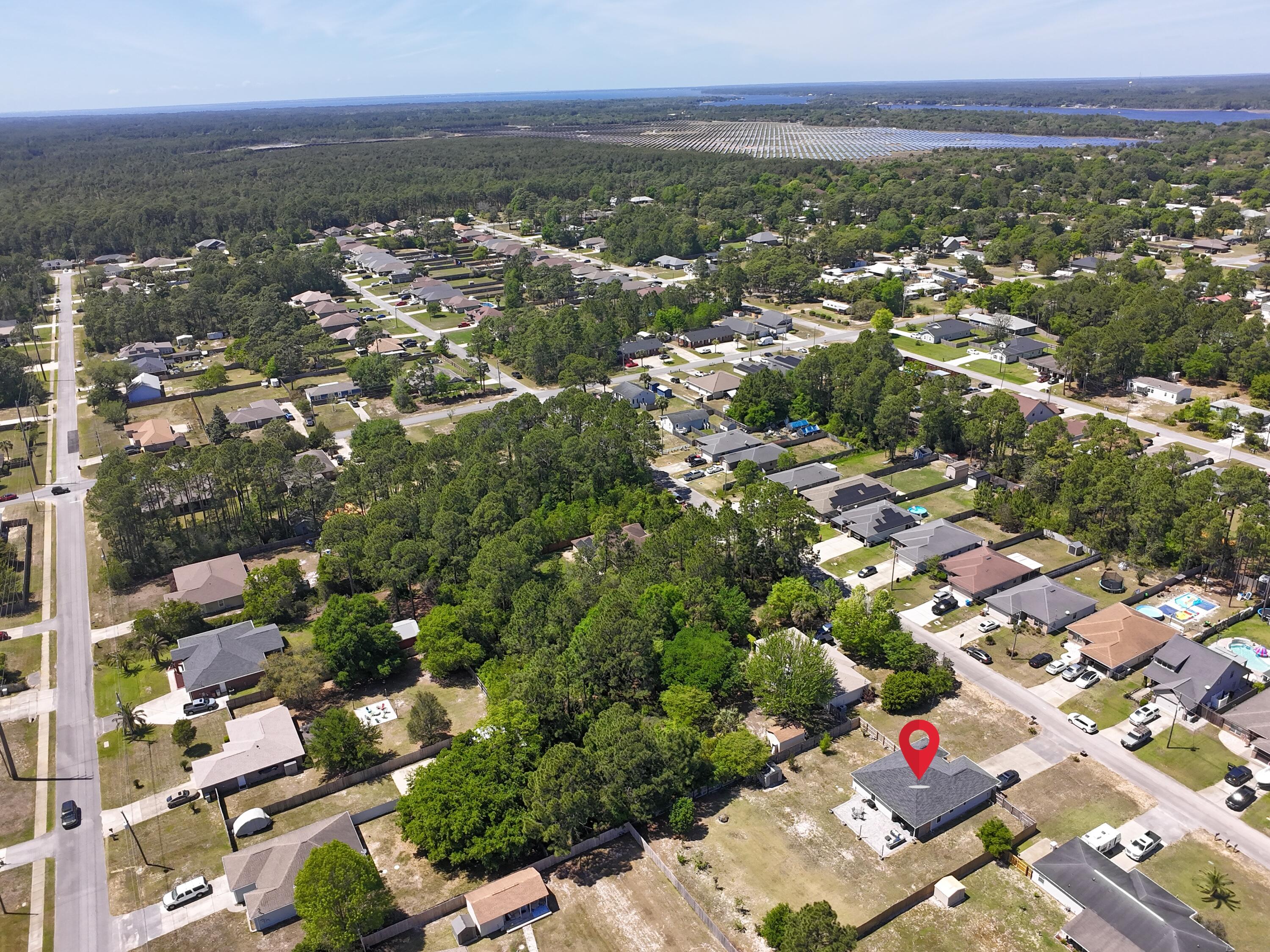 8271 Tavira Street Navarre, FL 32566 - Photo 55 of 60 an aerial view of multiple house