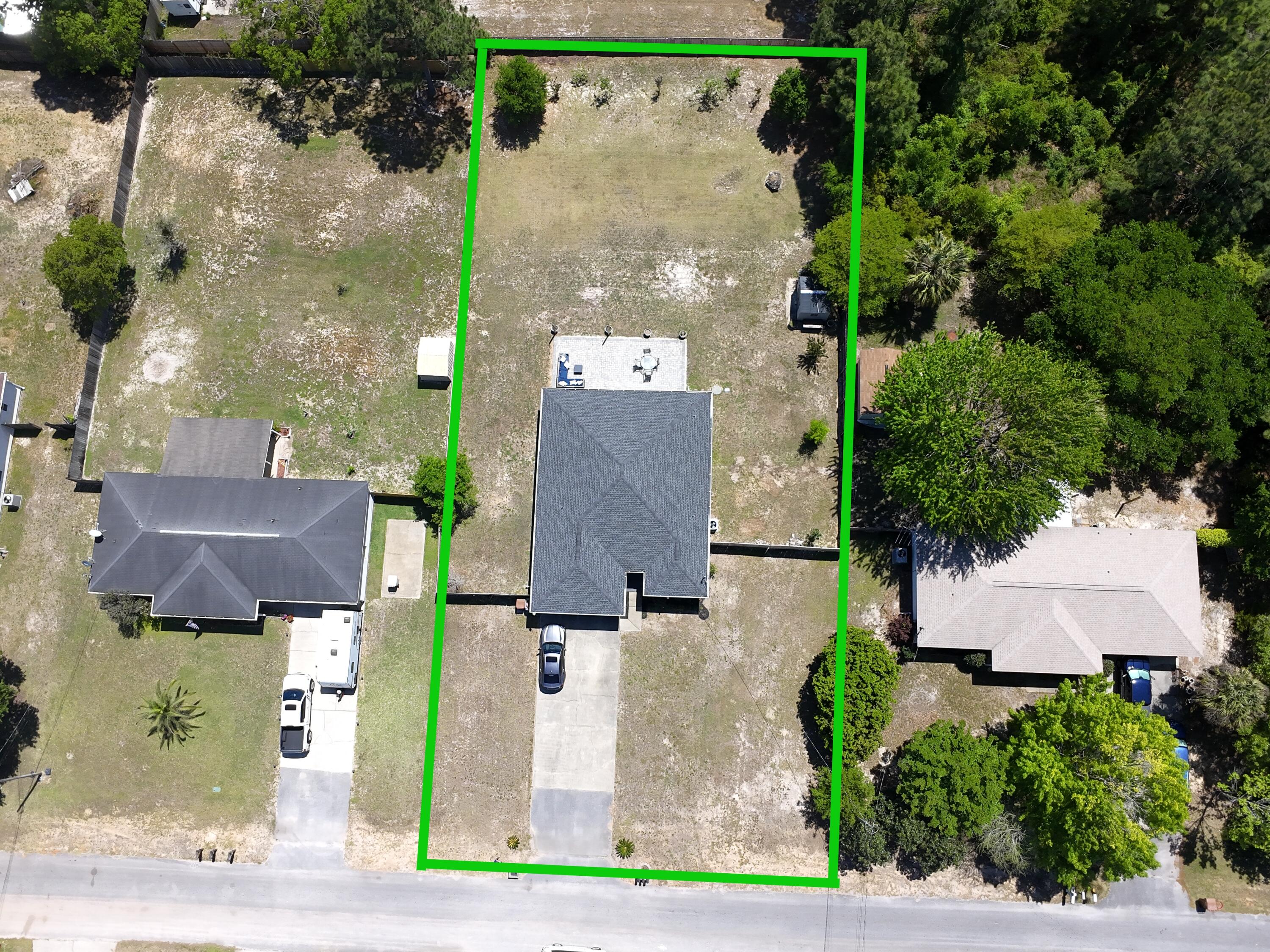 8271 Tavira Street Navarre, FL 32566 - Photo 6 of 60 an aerial view of a house with a outdoor space