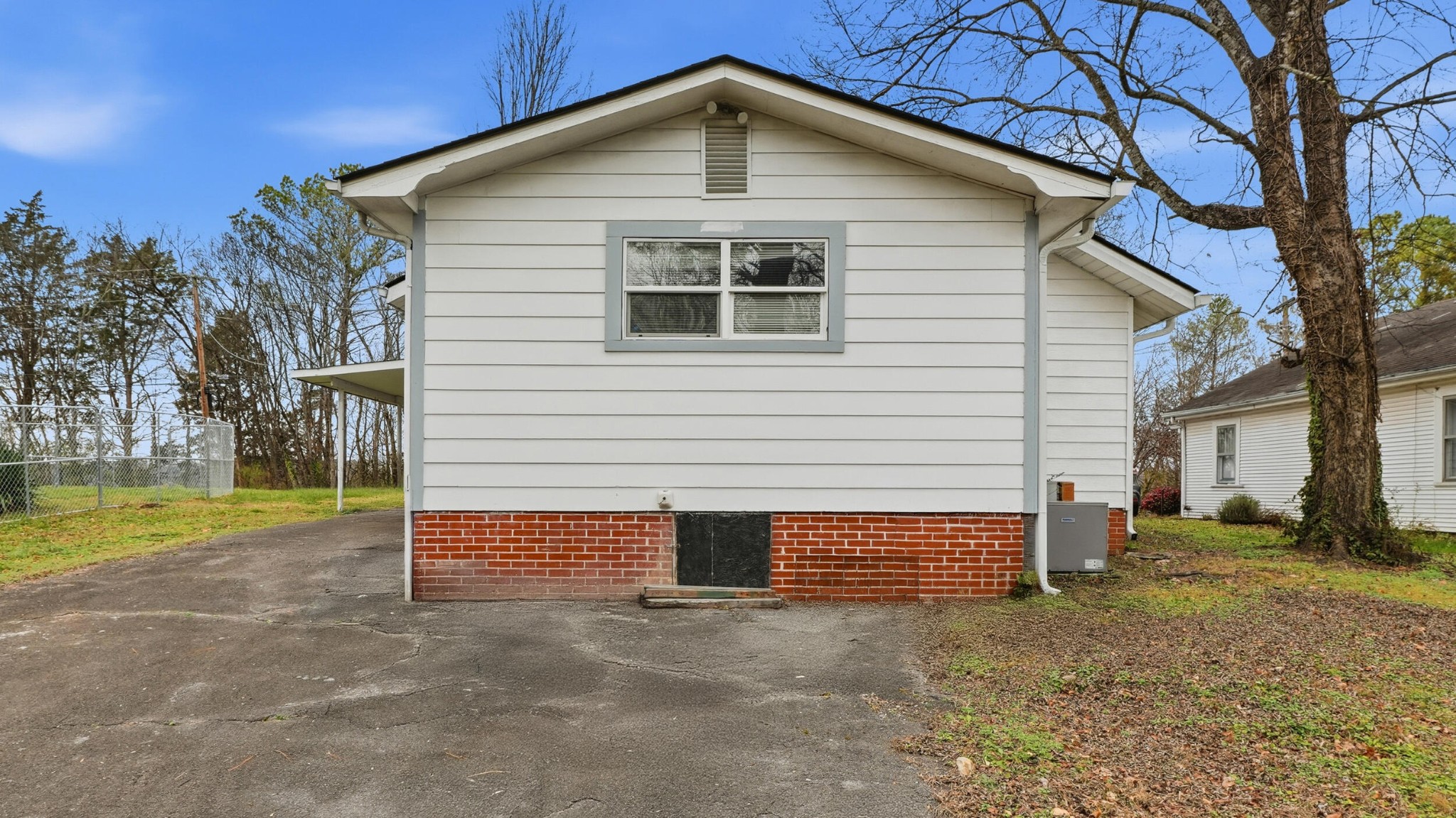 413 Crest Drive Southwest Cleveland, TN 37311 - Photo 15 of 20 a front view of a house with a yard