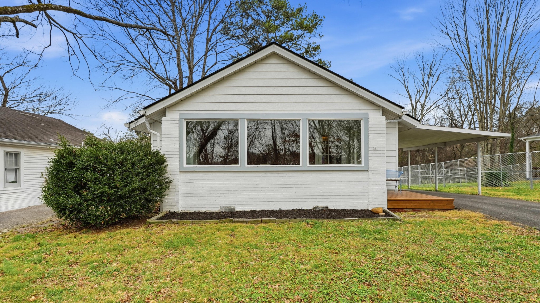 413 Crest Drive Southwest Cleveland, TN 37311 - Photo 2 of 20 a front view of a house with garden