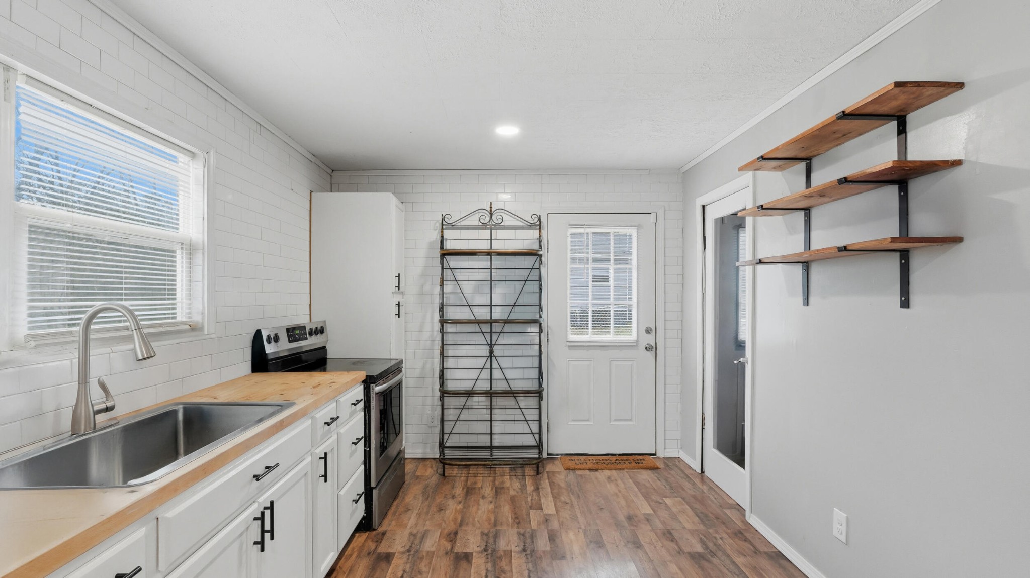 413 Crest Drive Southwest Cleveland, TN 37311 - Photo 6 of 20 a kitchen with stainless steel appliances a sink and wooden floor