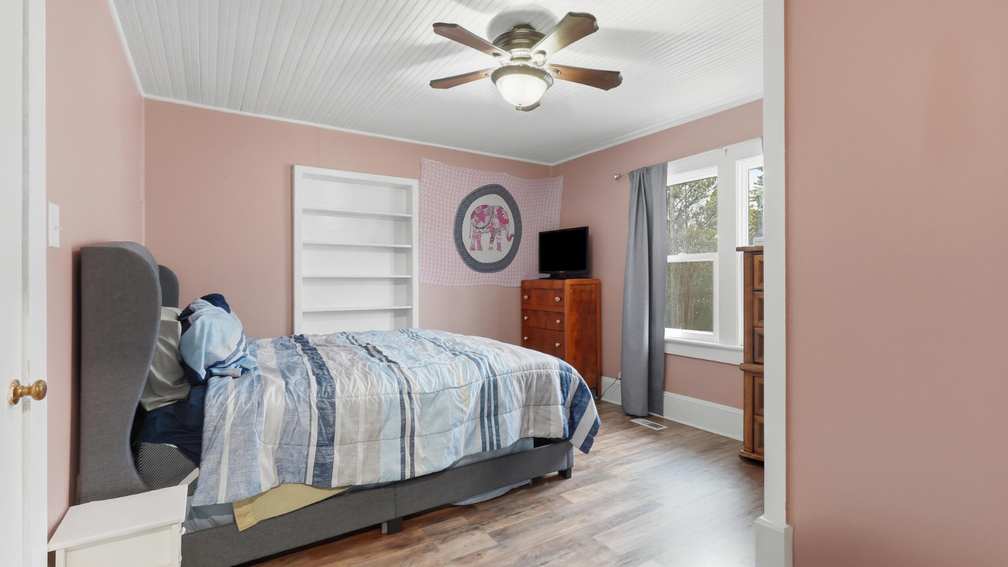 413 Crest Drive Southwest Cleveland, TN 37311 - Photo 8 of 20 a bedroom with a bed and a chandelier