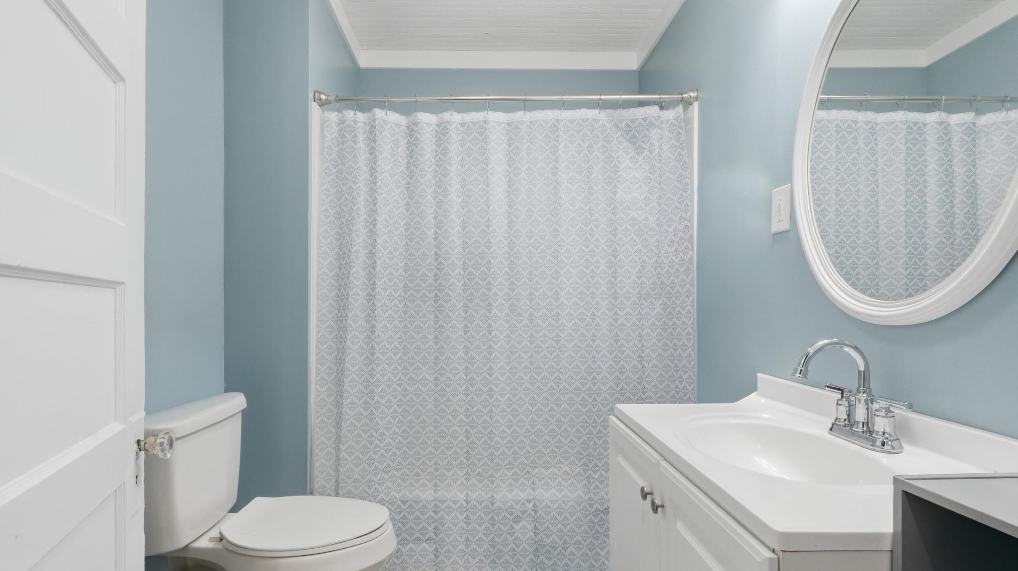 413 Crest Drive Southwest Cleveland, TN 37311 - Photo 10 of 20 a bathroom with a sink a toilet and a mirror