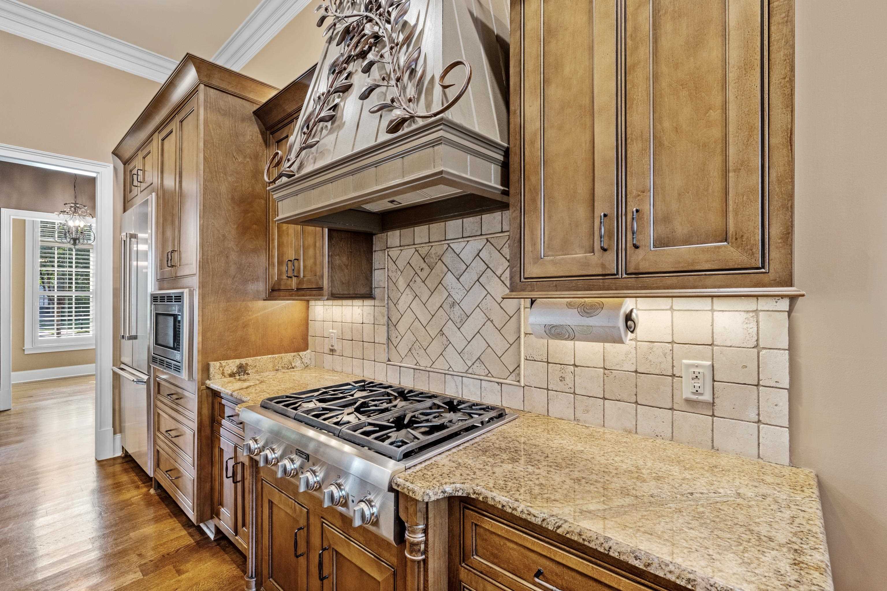 2840 Rue Jordan Cove Germantown, TN 38138 - Photo 15 of 40 a kitchen with a stove and a microwave