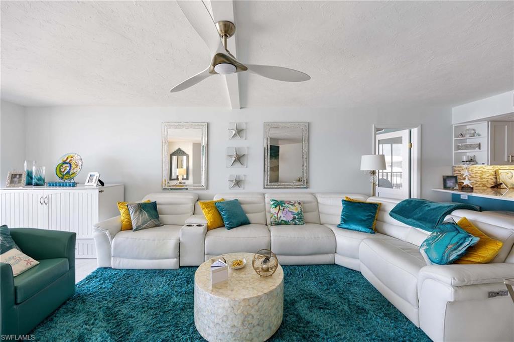 840 South Collier Boulevard, Unit 1104 Marco Island, FL 34145 - Photo 13 of 50 a living room with furniture and a couch