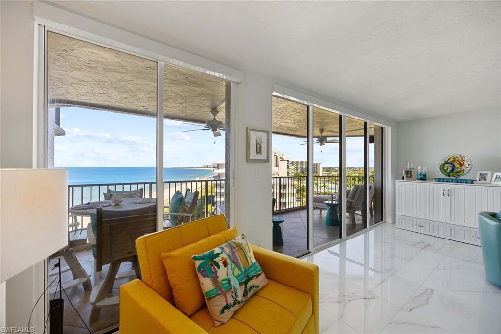 840 South Collier Boulevard, Unit 1104 Marco Island, FL 34145 - Photo 14 of 50 a living room with furniture tv and a large window