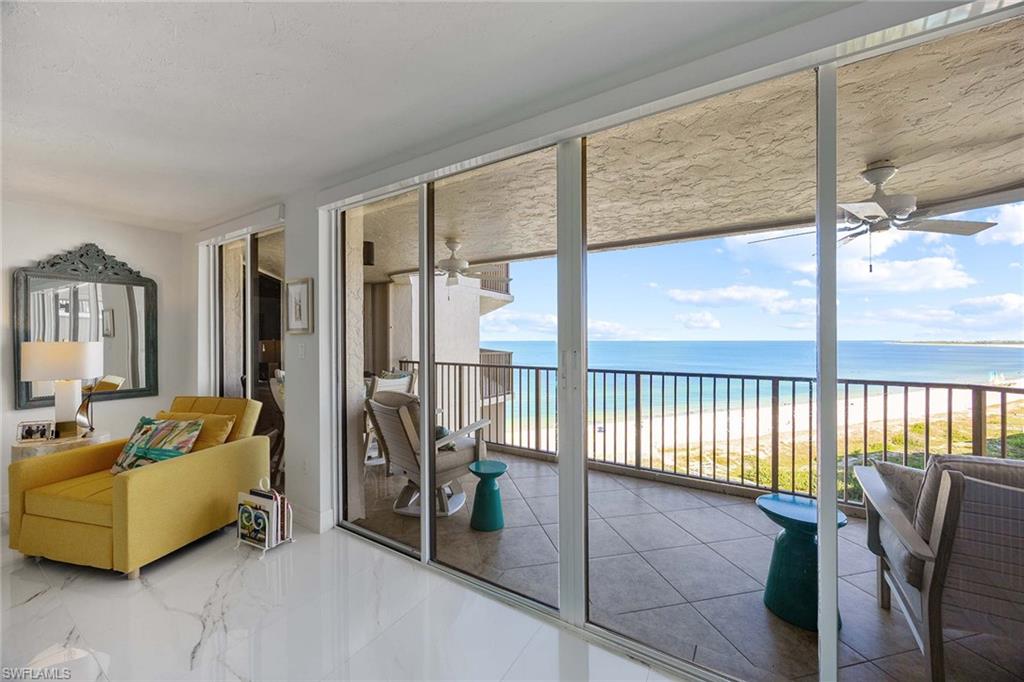 840 South Collier Boulevard, Unit 1104 Marco Island, FL 34145 - Photo 15 of 50 a living room with furniture and a large window