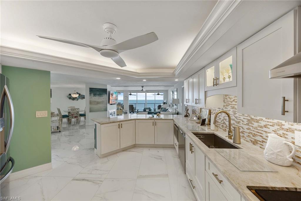 840 South Collier Boulevard, Unit 1104 Marco Island, FL 34145 - Photo 18 of 50 a kitchen with stainless steel appliances granite countertop a sink and dishwasher