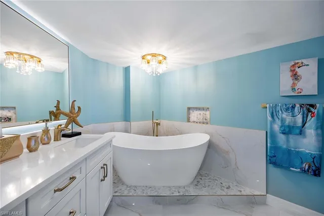 a bathroom with a shower sink and mirror