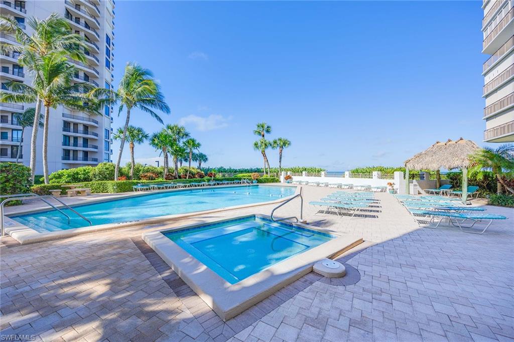 840 South Collier Boulevard, Unit 1104 Marco Island, FL 34145 - Photo 36 of 50 a view of a swimming pool with a lounge chairs