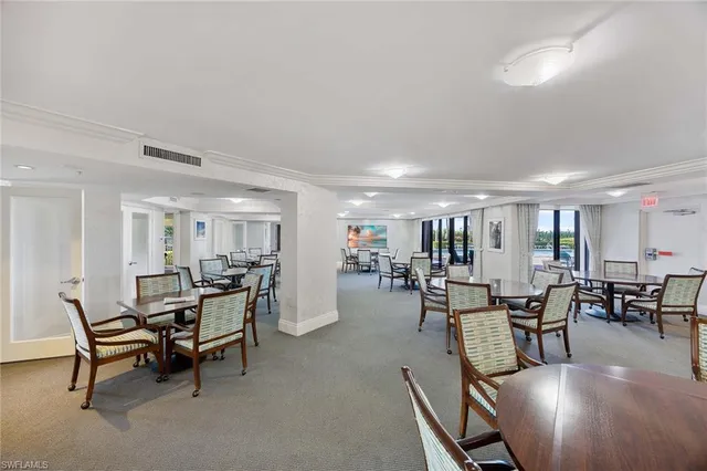a view of a work space with furniture and a potted plant