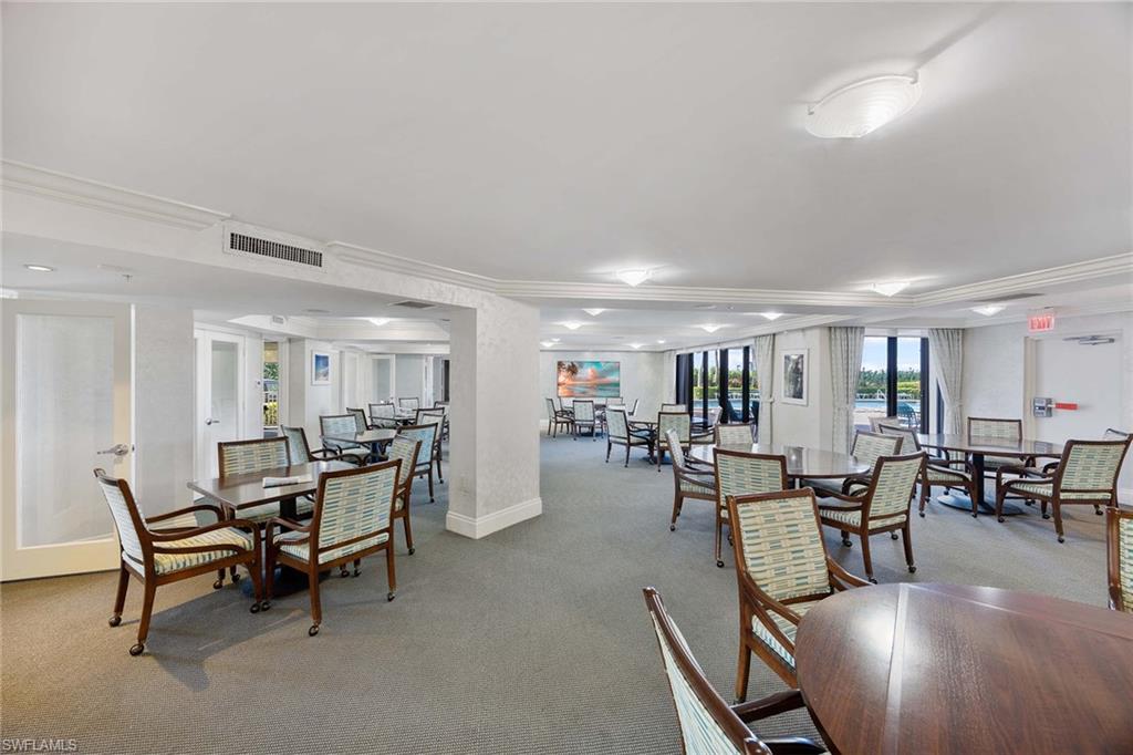 840 South Collier Boulevard, Unit 1104 Marco Island, FL 34145 - Photo 38 of 50 a view of a dining room with furniture window and outside view