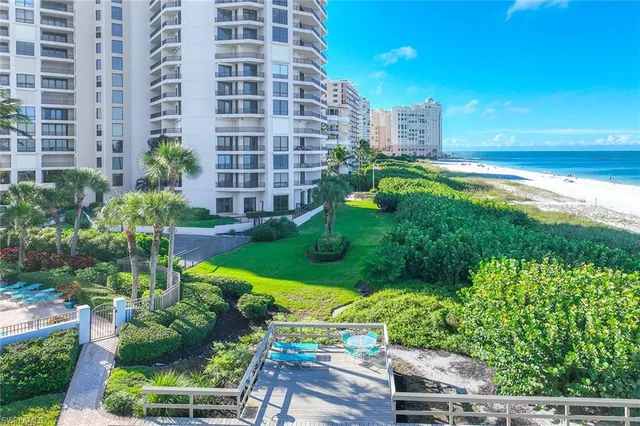 a view of a yard with an ocean view