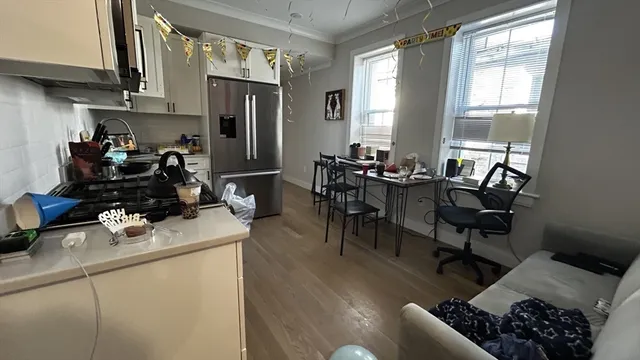 a room with furniture a window and gym equipment