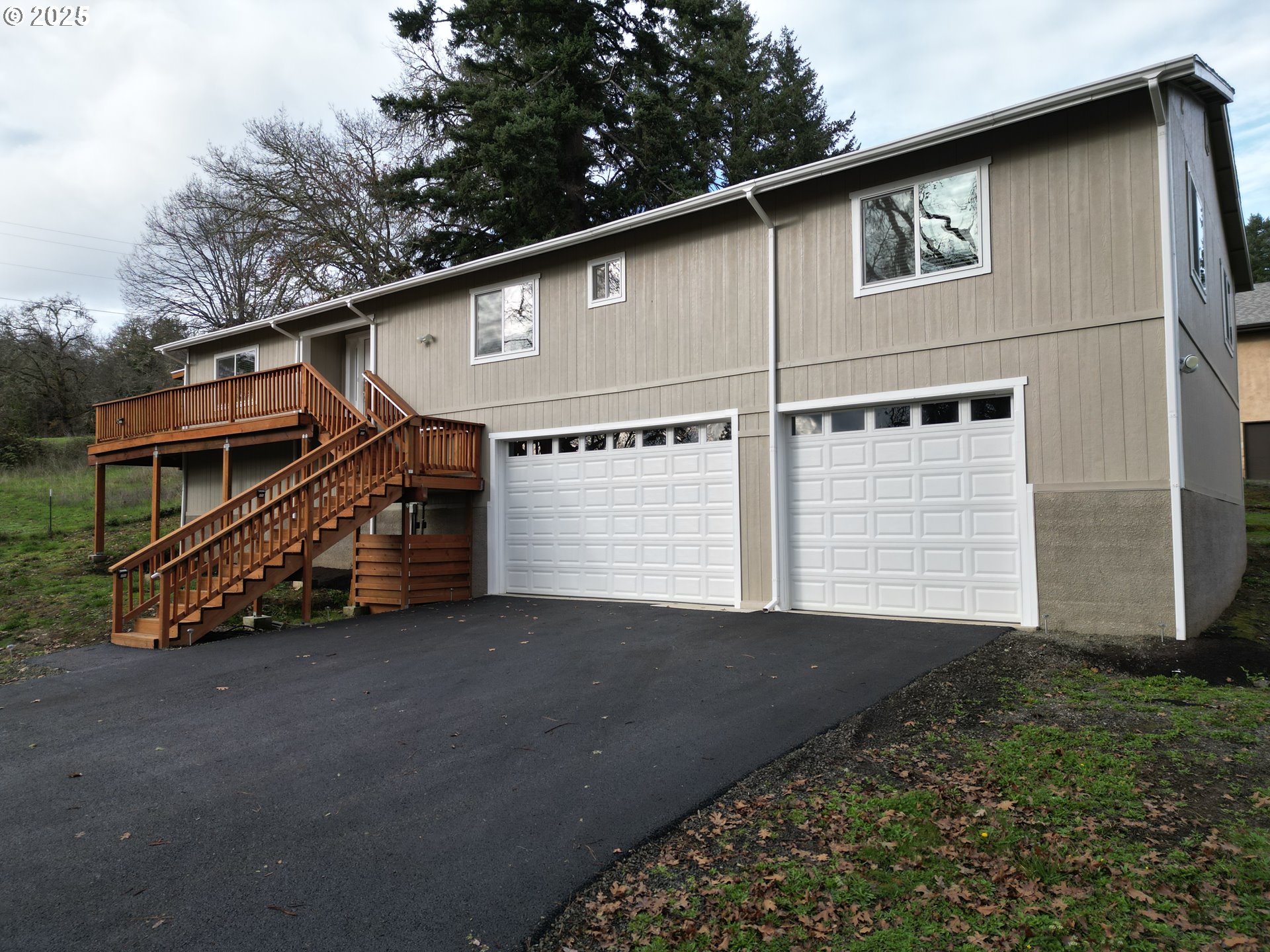 575 Cedar Street Sutherlin, OR 97479 - Photo 2 of 47 a view of a house with a yard and garage