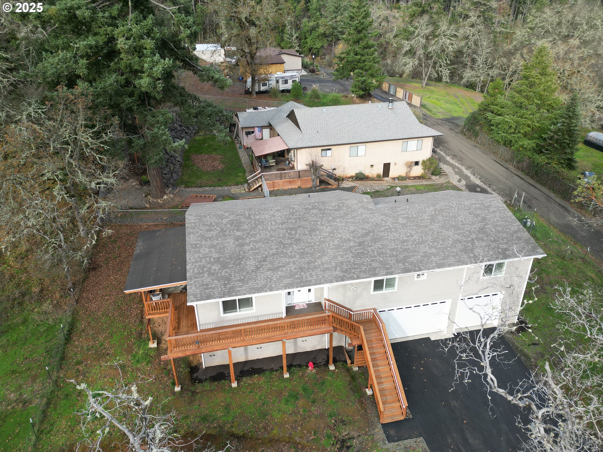 575 Cedar Street Sutherlin, OR 97479 - Photo 36 of 47 an aerial view of a house with swimming pool and large trees