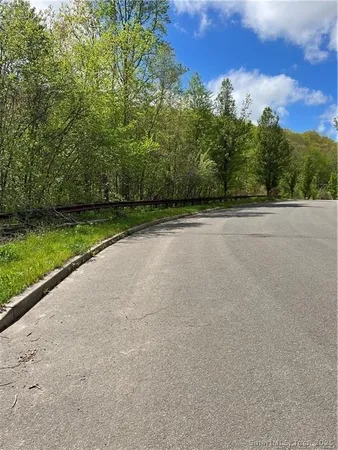 a view of a green field with clear sky